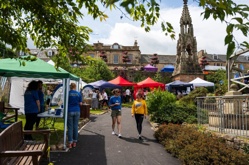 People walking through market