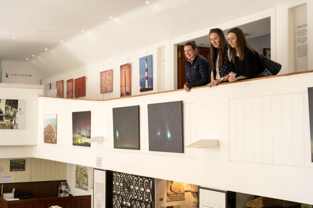 visitors standing on the gallery at the discovery centre