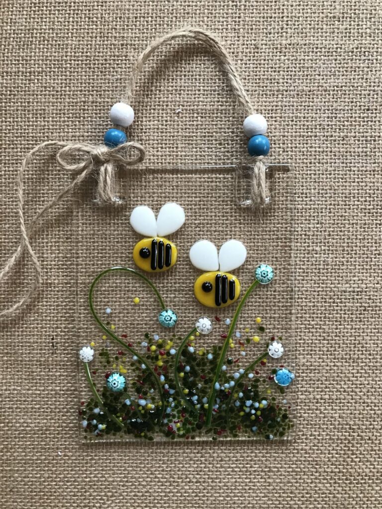 Bumble bees on glazed glass