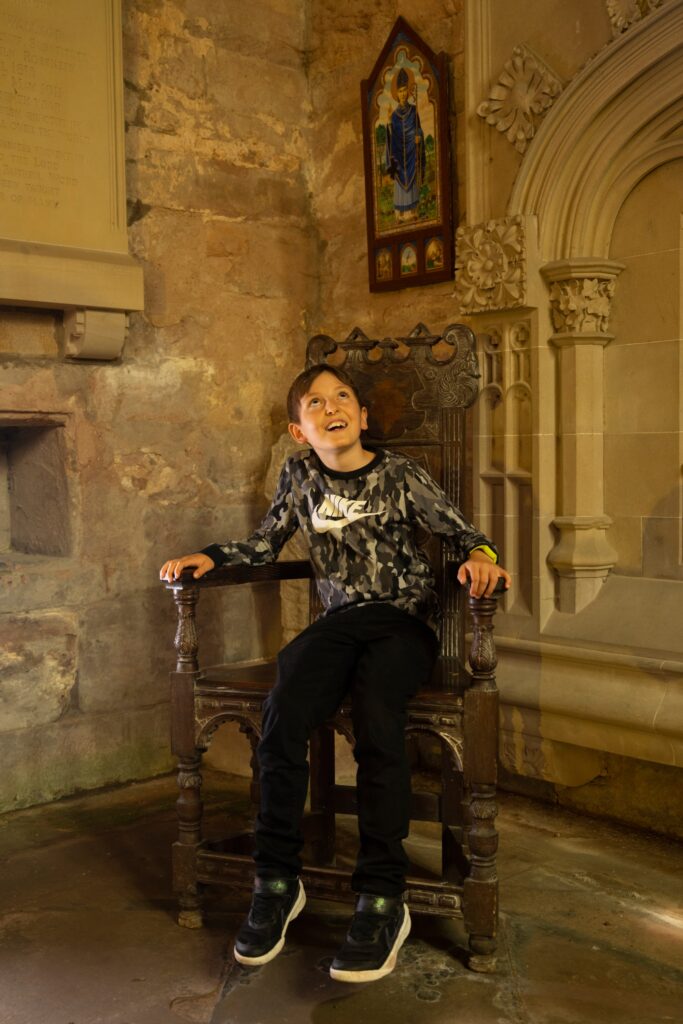 Sitting on a throne in tain