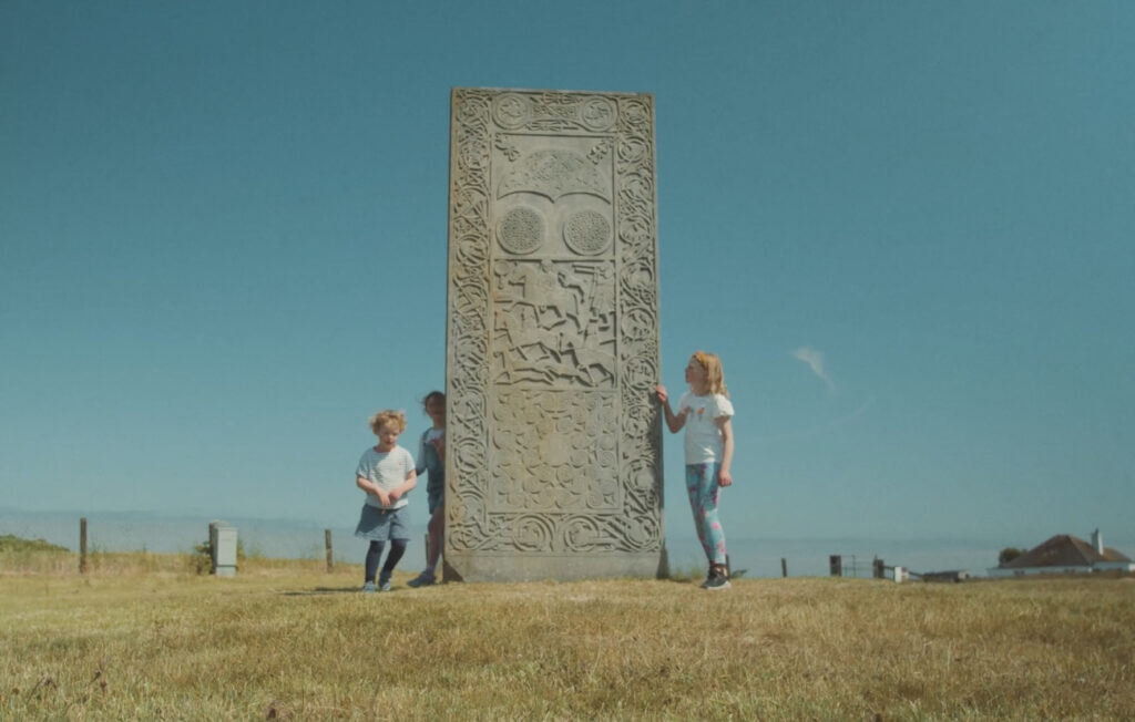 Children touching Hilton Stone 